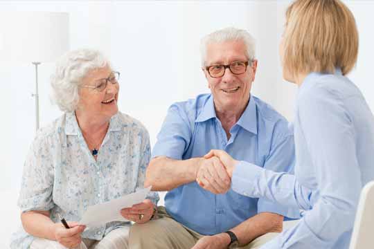 Couple talking to a hearing expert